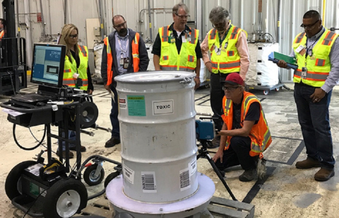 Workers with EM cleanup contractor Fluor Idaho test new technology for characterizing waste containers for the U.S. Environmental Protection Agency. 