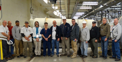 Paducah Depleted Uranium Hexafluoride Conversion Project workers pause for a photo to commemorate the project reaching its 9,000-metric-ton production goal ahead of schedule for fiscal 2019. Left to right, Bobby Ferren, Garry (Mike) Price, Michael (Mike) 