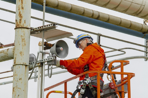 EM Paducah Site Electrician Steve Atherton installs electronic horns for the criticality accident alarm system to replace the air-powered horns that have been used since the 1990s.