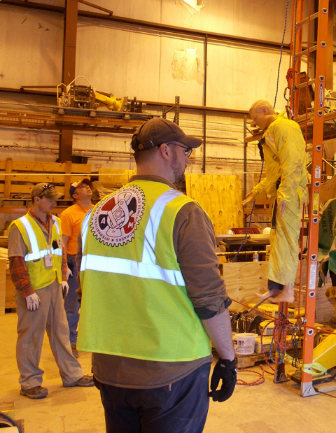 Steve Wedvik, center, works in CH2M HILL BWXT West Valley’s (CHBWV) environmental services division, while also serving as the fire chief for the West Valley Volunteer Hose Company. 
