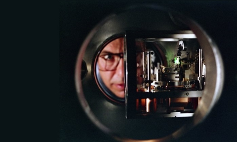 A man looking through some photovoltaic technology