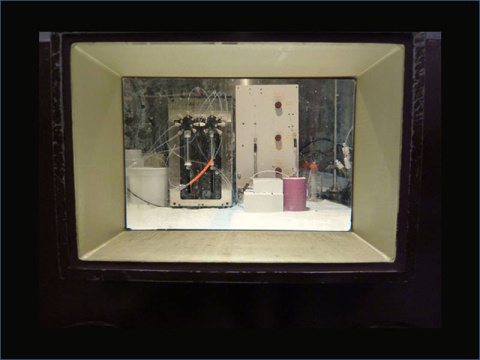 Prototype fluidic system for zirconium-89 purification. Image taken through a hot cell window at the Department of Radiology, University of Washington.