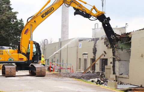 Workers demolish the west portion of Building 3017 at the Oak Ridge Site. 