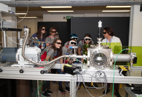 Laboratory researcher Adrianna Reyes-Newell (right) shows camp participants how laser-induced breakdown spectroscopy works. The ChemCam instrument on the Curiosity rover uses this technology to investigate the composition of Martian rocks. Laboratory researcher Adrianna Reyes-Newell (right) shows camp participants how laser-induced breakdown spectroscopy works. The ChemCam instrument on the Curiosity rover uses this technology to investigate the composition of Martian rocks.