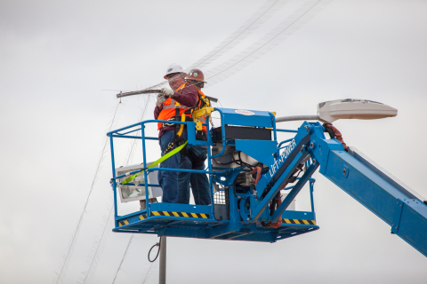 Workers repair the lightning protection system at EM’s Waste Isolation Pilot Plant.