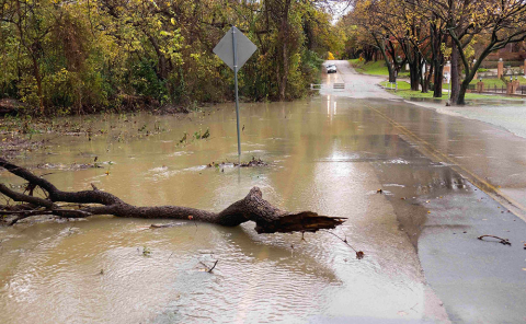 Water flooding a residential road.