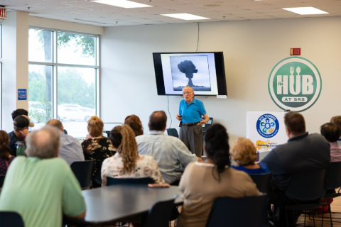 Walt Joseph, who began working at the Savannah River Site in the early 1950s, talks with Savannah River Nuclear Solutions employees about the site's valuable contributions to the U.S.