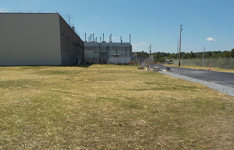 Before-and-after photos of the Separations Process Research Unit building demolition and site restoration fieldwork.