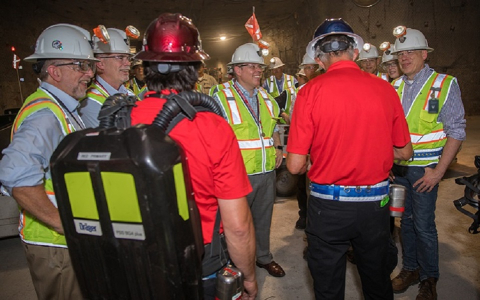Ike White, center, Senior Advisor for EM, receives a briefing from members of the Waste Isolation Pilot Plant 