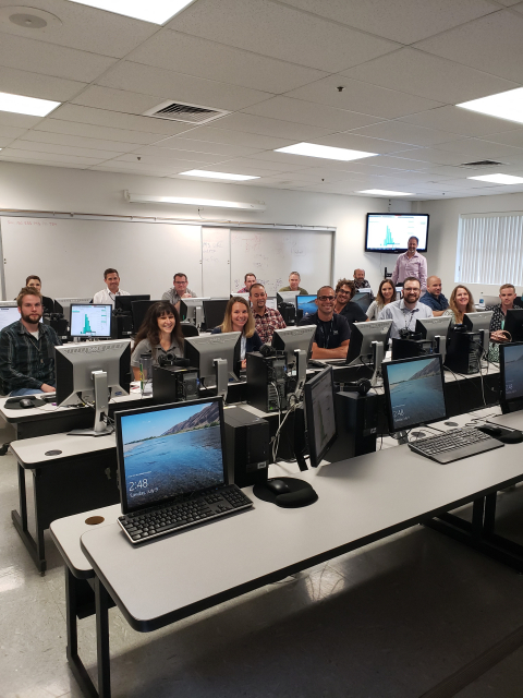 EM and Hanford Site contractors pose for a photograph while training on a new piece of software designed to standardize risk assessments across the site. 
