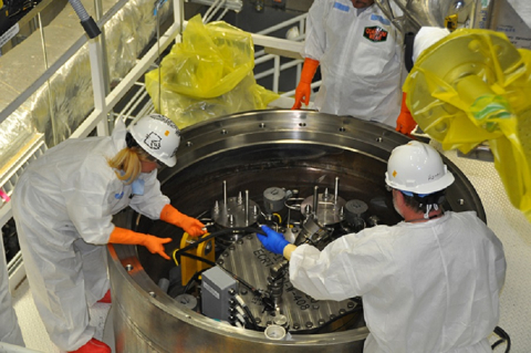 Workers prepare the 20th and final sludge container for shipment at the Hanford Site. The transfer of sludge from K West to T Plant reduces a significant risk to the Columbia River and marks a key accomplishment in the overall Hanford cleanup mission.