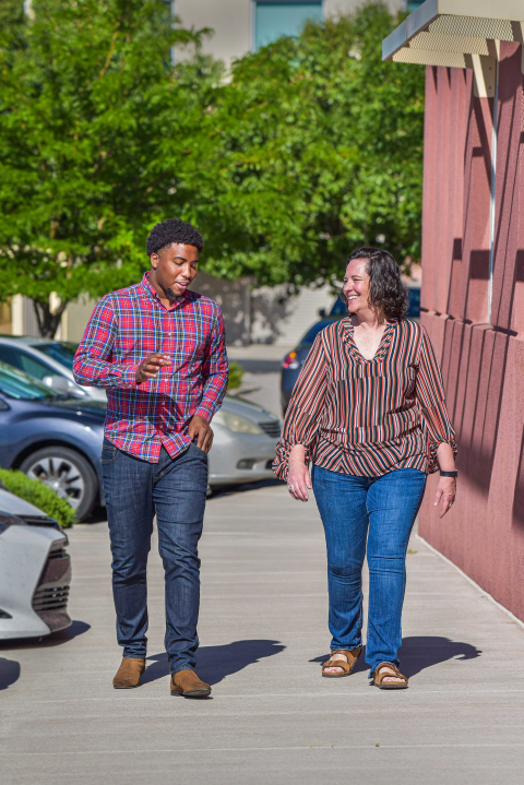 Logan Carpenter, left, walks with Sandia National Laboratories’ CECOR coordinator Tommie Kuykendall. Logan Carpenter, left, walks with Sandia National Laboratories’ CECOR coordinator Tommie Kuykendall.