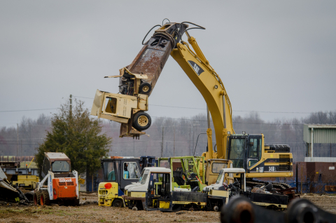 Four Rivers Nuclear Partnership Heavy Equipment Operator Brad Langston begins to shear a powered industrial truck stored at the C-740 Material Yard in order to downsize it for removal.