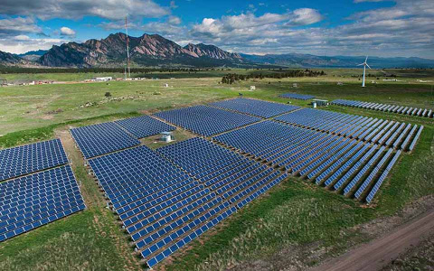 Solar panels on the NREL campus near the mountains.