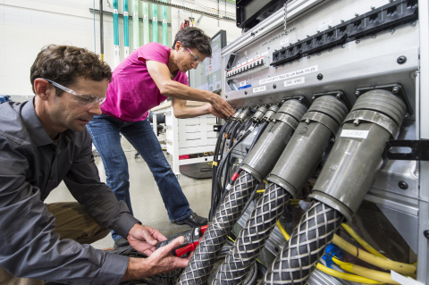 NREL researchers work on the Consolidated Utility Base Energy System. NREL researchers work on the Consolidated Utility Base Energy System.