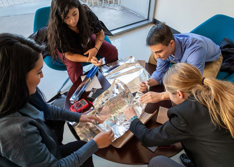 Students at the NREL Mini-Semester (from left) Melissa Perez, Jacqueline Solis-Armanta, Sean Regalado-Love, and Shannon Hamp design a solar concentrator. Students at the NREL Mini-Semester (from left) Melissa Perez, Jacqueline Solis-Armanta, Sean Regalado-Love, and Shannon Hamp design a solar concentrator.