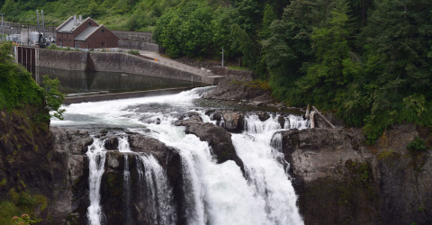 View of the Snoqualmie Falls Hydroelectric Plant on a cloudy day.