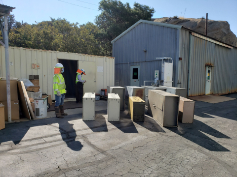 As part of the deactivation process, workers from DOE contractor North Wind gather furnishings taken from buildings in the Radioactive Materials Handling Complex that will be demolished later this summer at the Energy Technology Engineering Center.