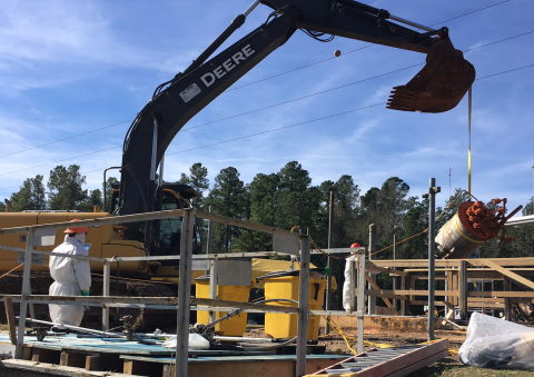 Workers prepare equipment removed from a recently demolished contaminated structure at the Savannah River Site to be permanently encapsulated within cement-like grout.