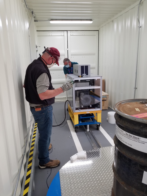 Characterization equipment operators Tim Carlton, left, and Todd Shepley perform a virtual equipment test. 