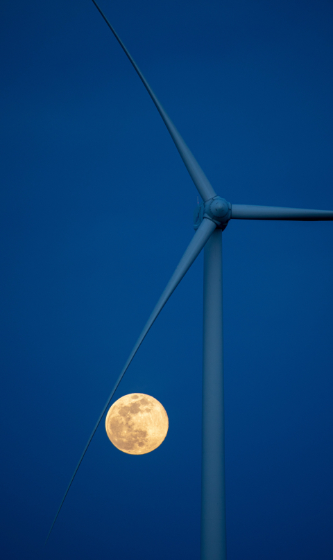 The Pink Supermoon rises near the National Renewable Energy Laboratory's Flatirons Campus wind turbine.
