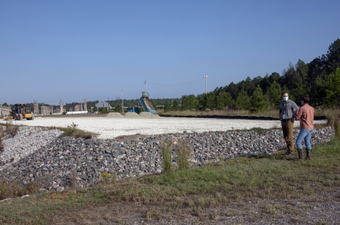 Savannah River Nuclear Solutions project manager Kelsey Holcomb discusses the cleanup of the D-Area Coal Storage Yard with DOE-Savannah River Federal Project Director Karen Adams at the project site.