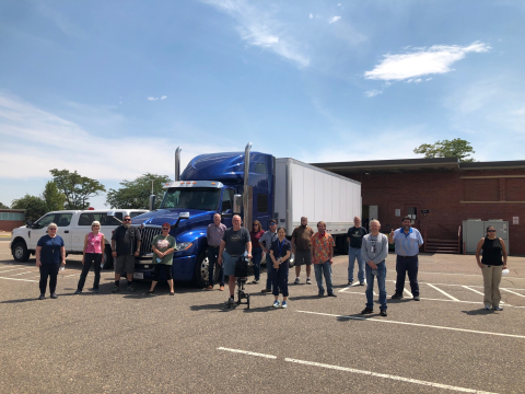 Team members at the Denver Federal Center are shown after loading archive material for secure transport to Los Alamos National Laboratory in August.