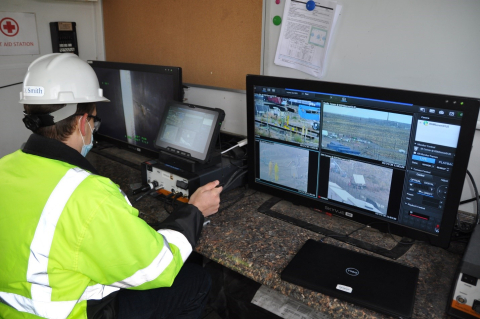 Devan Smith, an engineer for EM Richland Operations Office contractor CH2M HILL Plateau Remediation Company, monitors progress as workers prepare to stabilize three aging underground disposal structures by filling them with engineered grout.