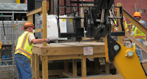Employees follow COVID-19 safety protocols while working at Oak Ridge.
