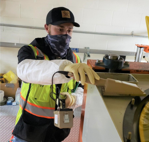 Ethan Hoopes, a radiation control technician for EM contractor Fluor Idaho, surveys a piece of equipment at the Advanced Mixed Waste Treatment Project at the Idaho National Laboratory Site.