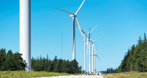 Wind turbines against a cloudless sky.