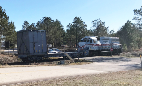 A train pushes a container full of old equipment from H Canyon to the Solid Waste Management Facility for disposal at the Savannah River Site. The equipment is being removed to make way for a new H Canyon spent nuclear fuel dissolving campaign. 