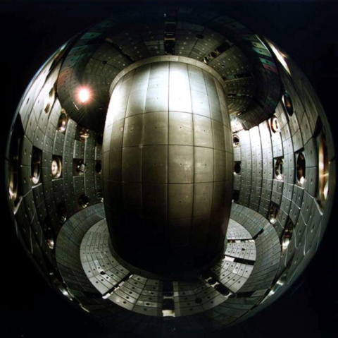 Tokamaks, such as the Tokamak à Configuration Variable (TCV) shown here, are donut-shaped devices that confine plasma to produce fusion reactions. The shape of the plasma cross-section affects the quality of the containment. 