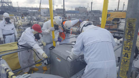 Workers with EM tank operations contractor Washington River Protection Solutions install remotely operated, specialized equipment to retrieve waste from single-shell tank AX-103 at the Hanford Site.