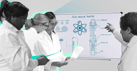 Researchers around a white board
