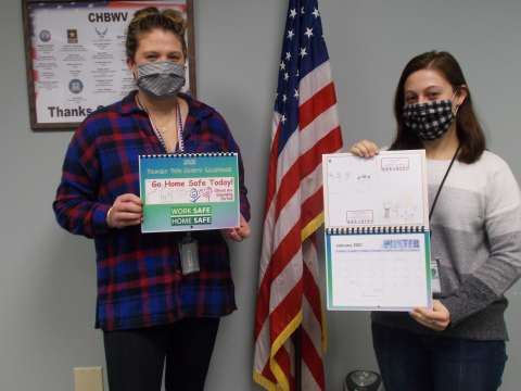 Pictured with this year’s Family Fun Safety Calendar are Jordan Seltzer, left, and Mary Janik with the CH2M HILL BWXT West Valley records management division.