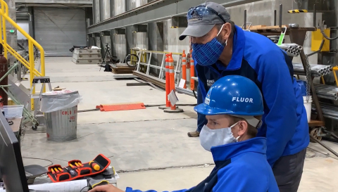 Fluor Idaho Calcine Retrieval Project Manager Howard Forsythe, right, and Chief Engineer Tim O’Connor monitor robotic testing for EM's calcine retrieval project at the Idaho National Laboratory Site.
