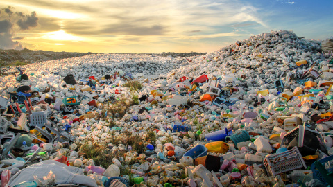 A landfill full of plastic bottles and chairs