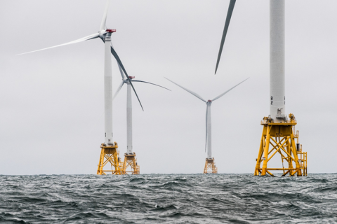 Offshore wind turbines at sea.