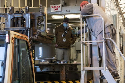 Savannah River Nuclear Solutions Operator Norman Sykes load a transuranic waste drum into a real-time radiography unit for characterization at the Solid Waste Management Facility at the Savannah River Site.