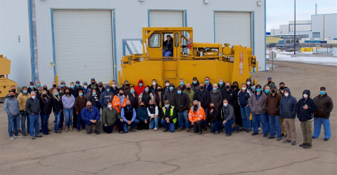 The Idaho Environmental Coalition and DOE Idaho Spent Nuclear Fuel management team are shown outside the Chemical Processing Plant-666 following the recent completion of Advanced Test Reactor fuel retrieval.