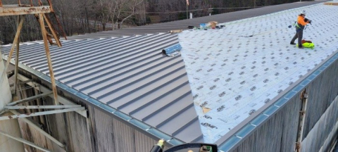 A small business contractor helped replace the roof at the Molten Salt Reactor Experiment at the Oak Ridge National Laboratory earlier this year as part of a series of projects to keep the building safe and stable as it awaits demolition in the years ahead.