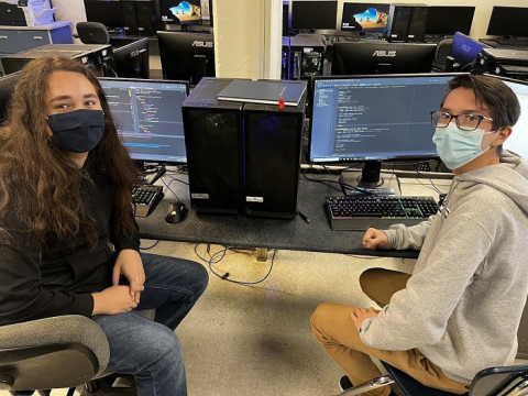 Carlsbad High School students Andres Chappa, left, and Riley Antiporda are designing a system to address the lack of real-time information available to parents and school administrators when students are on a school bus. They’re undertaking the project as part of an engineering class.