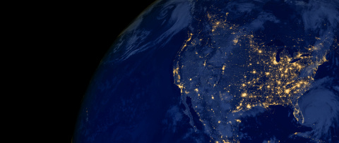 A view of the united states from orbit at night time.