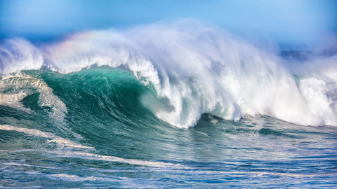 Ocean waves roll in the ocean.