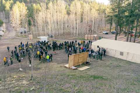 Members of Great Basin Team 1 gather for a morning briefing at base camp in Jemez Springs, New Mexico. Crews have been mobilized since April 22 to focus their firefighting expertise on the Cerro Pelado fire. 