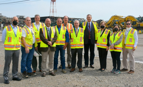 Officials gather outside the Building X-326 demolition project while on a tour of the Portsmouth Site.