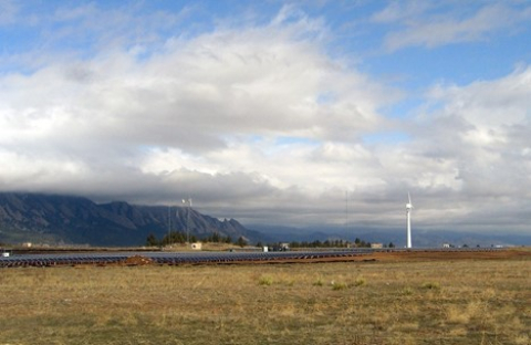 Solar panels with clouds overhead