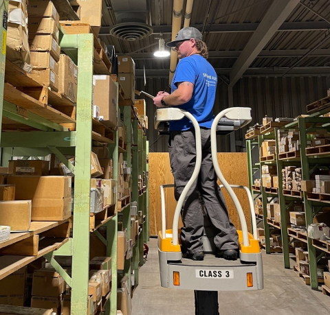 Hanford Mission Integration Solutions Storekeeper Cooper Whitney counts items in a Hanford Site warehouse as part of the 100% wall-to-wall inventory process.