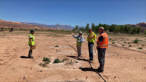 Moab Uranium Mill Tailings Remedial Action Project Federal Cleanup Director Russell McCallister, right, looks on as Moab Site Revegetation Manager Katrina Lund, an EM contractor.